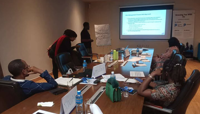 Diverse professional team celebrating success with high-fives